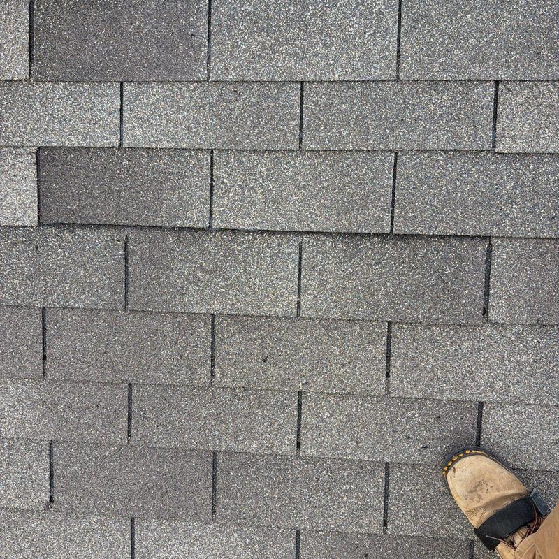 Asphalt roof shingles with hail damage inspection