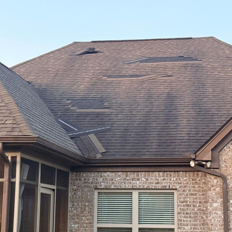Asphalt shingle roof with hail and storm damage