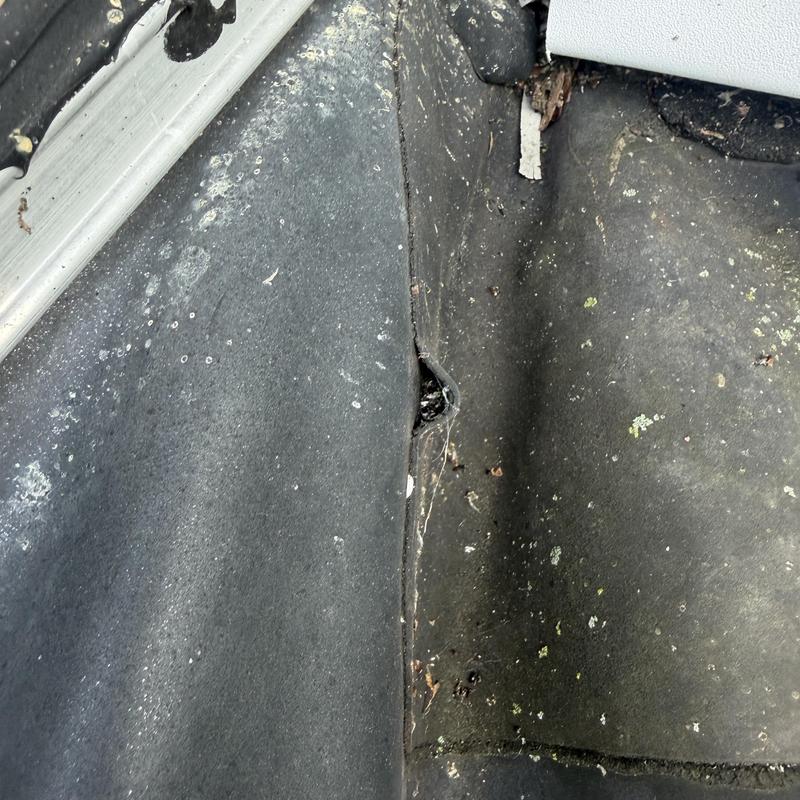 EPDM rubber roof seam separation near chimney EPDM rubber roof seam separation near chimney