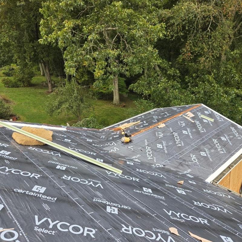 Roof underlayment installation on residential home