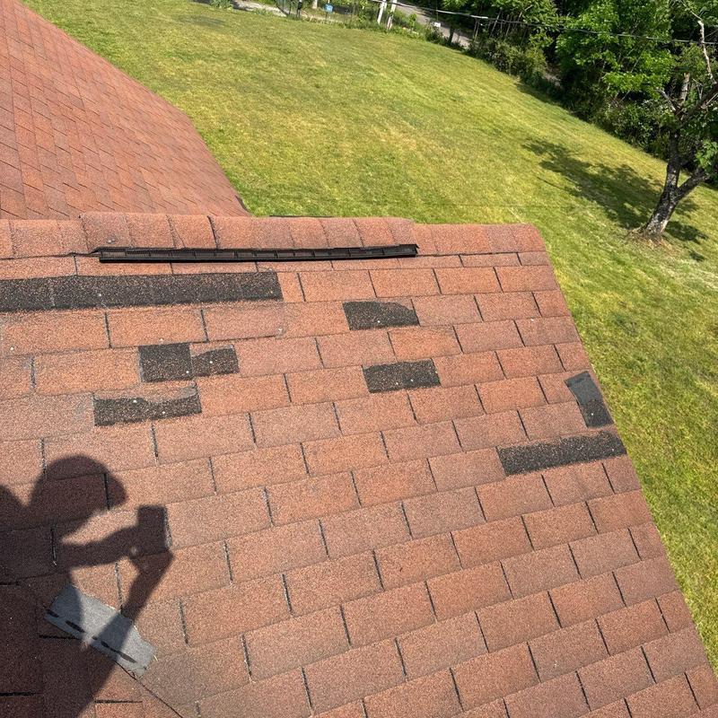Asphalt shingles with hail damage on residential roof