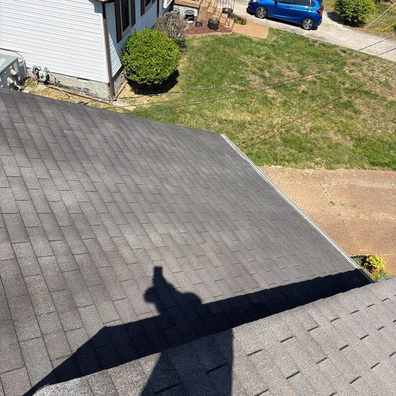 Asphalt shingle roof inspected for hail damage and wear