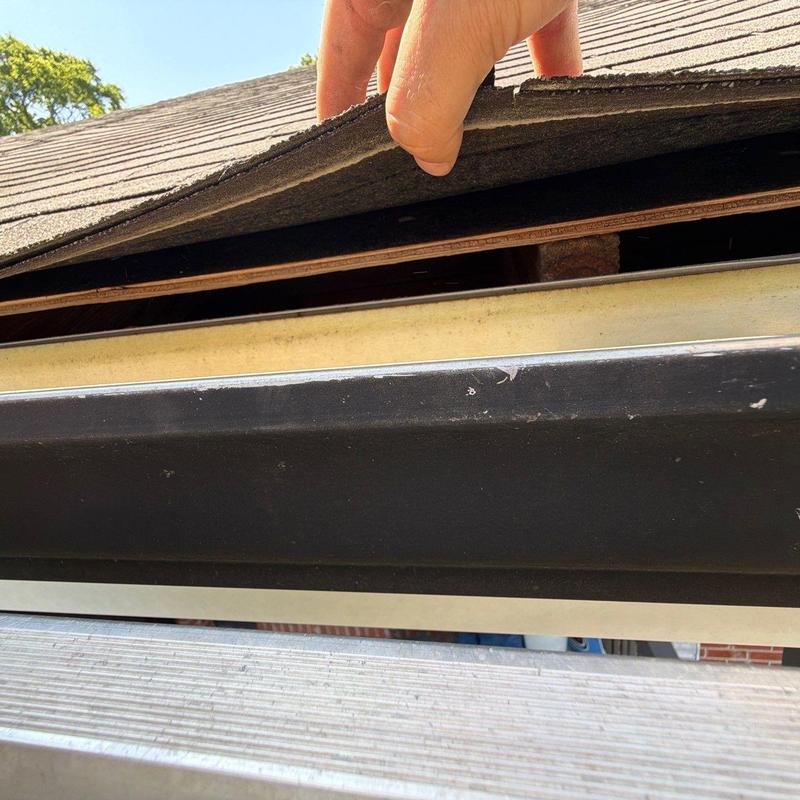 Roof shingles lifted for hail damage inspection