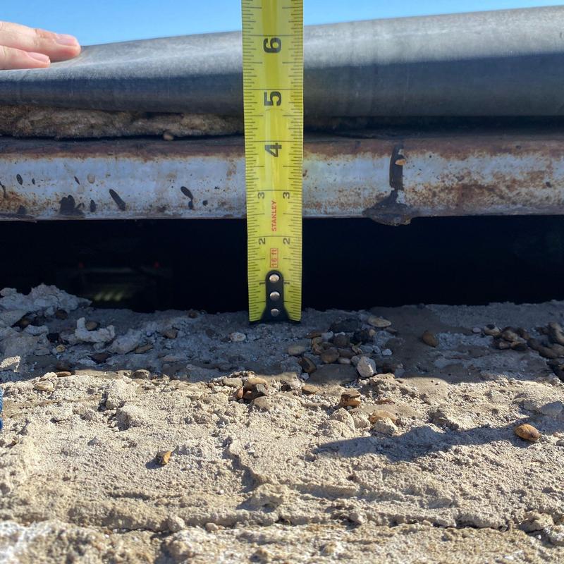 Concrete roof edge gap measurement with tape Concrete roof edge gap measurement with tape