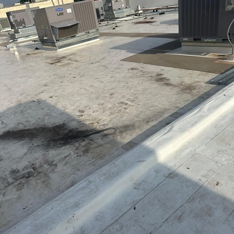Concrete roof surface with HVAC units and repairs Concrete roof surface with HVAC units and repairs