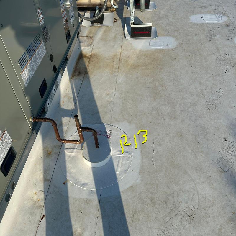 Concrete roof patch with copper plumbing pipes Concrete roof patch with copper plumbing pipes
