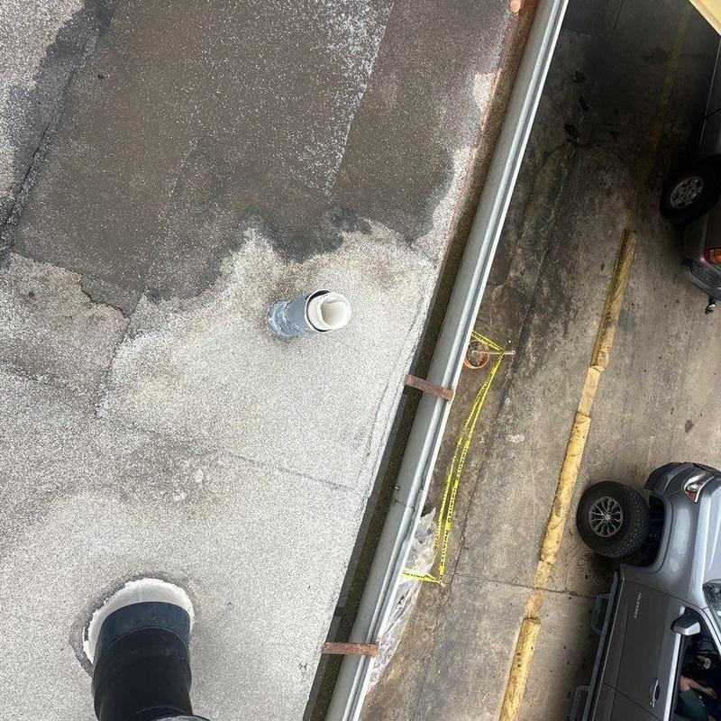 Concrete roof surface with repaired plumbing vent and gutter Concrete roof surface with repaired plumbing vent and gutter