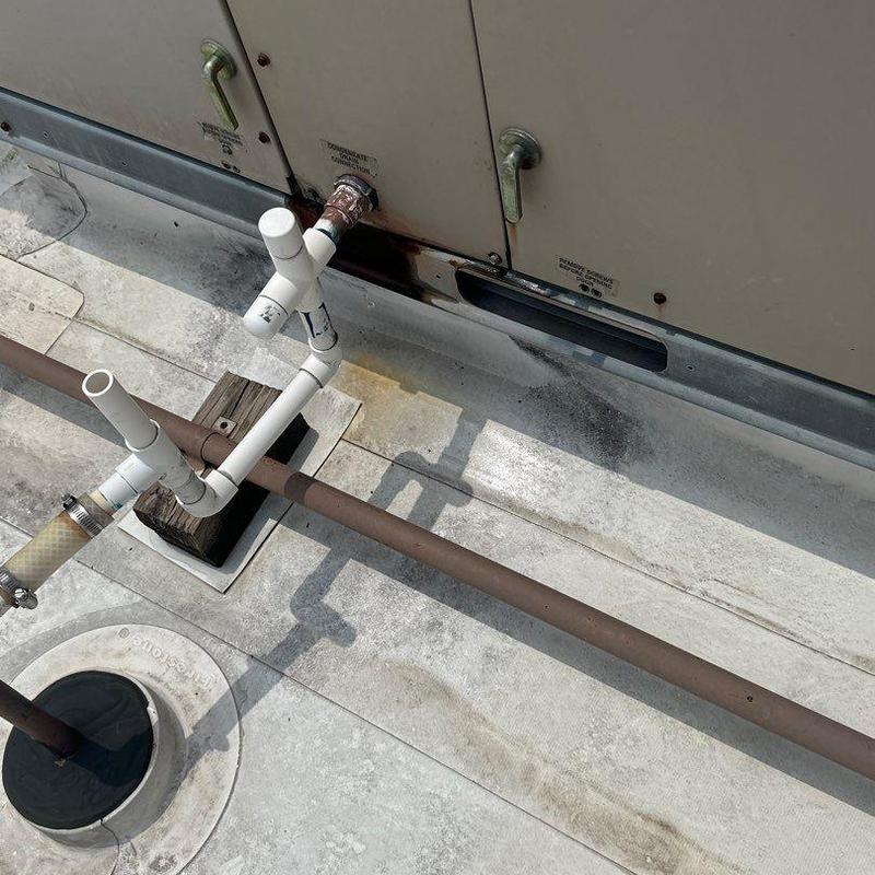 HVAC condensate drain pipes on rooftop system HVAC condensate drain pipes on rooftop system