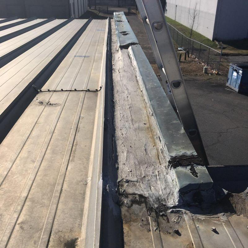 Metal roof perimeter flashing and seams with ladder