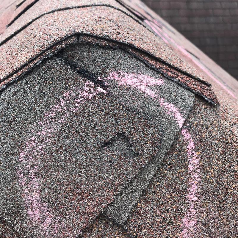 Architectural roof shingles with marked hail damage