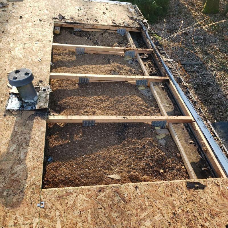 Roof decking replacement with exposed framing and debris
