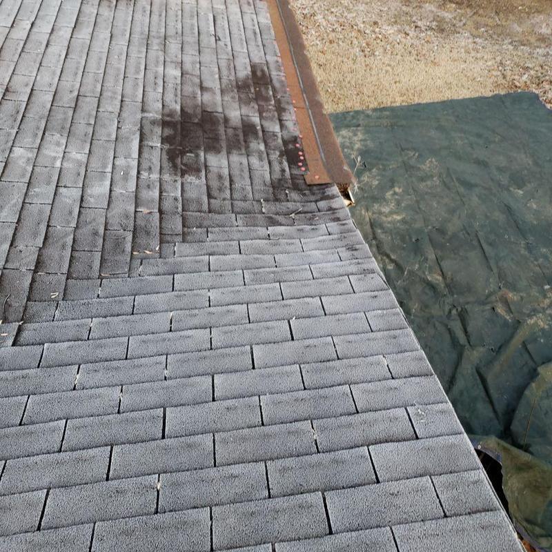 Shingle roof with rusted metal flashing and discoloration