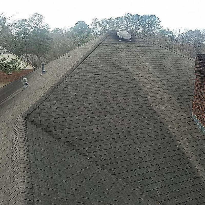 Charcoal-gray architectural shingle roof with vents