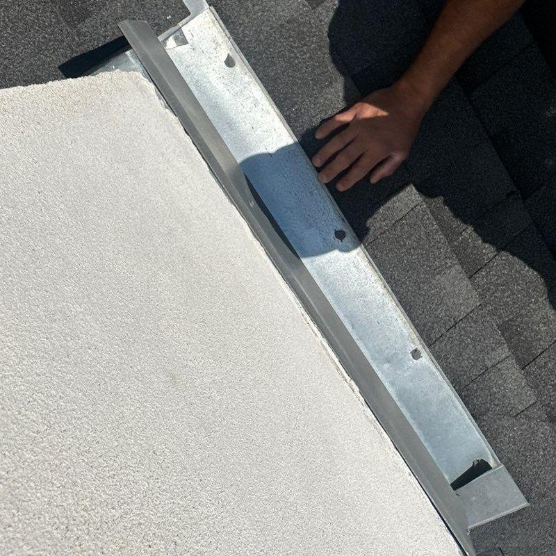 Roof flashing installation on shingle roof and stucco wall Roof flashing installation on shingle roof and stucco wall