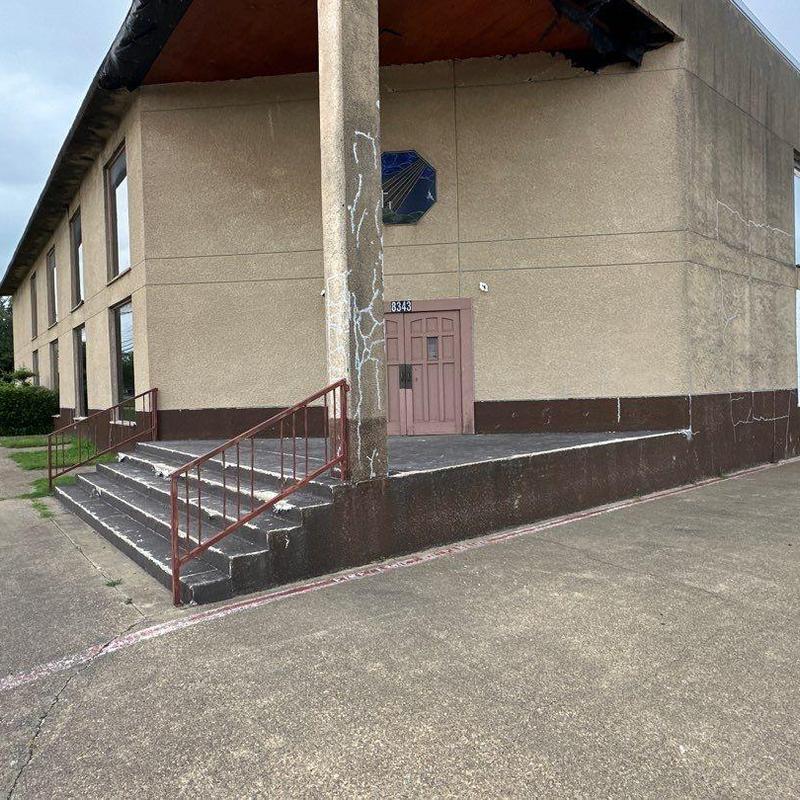 Stucco exterior walls with cracking near church entry Stucco exterior walls with cracking near church entry
