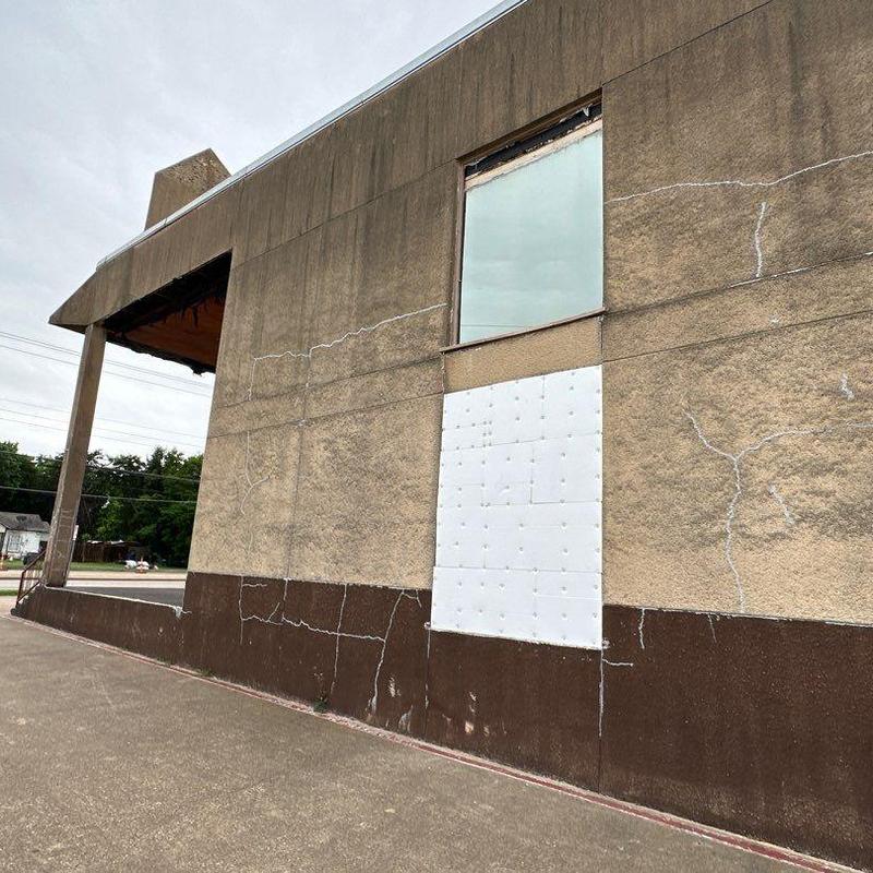 Stucco wall with window and crack repairs Stucco wall with window and crack repairs