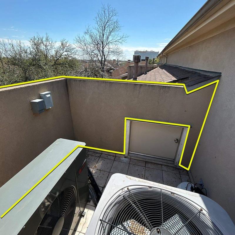 Stucco terrace walls and adjoining shingle roof sections Stucco terrace walls and adjoining shingle roof sections