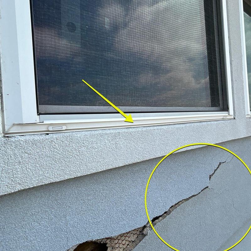 Exterior stucco cracks near window and screen frame Exterior stucco cracks near window and screen frame