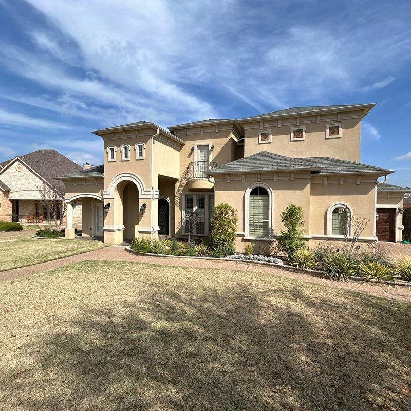 Exterior stucco cracks near windows and downspout Exterior stucco cracks near windows and downspout