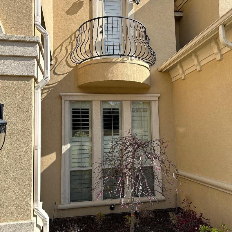 Exterior stucco cracks near downspout and windows Exterior stucco cracks near downspout and windows