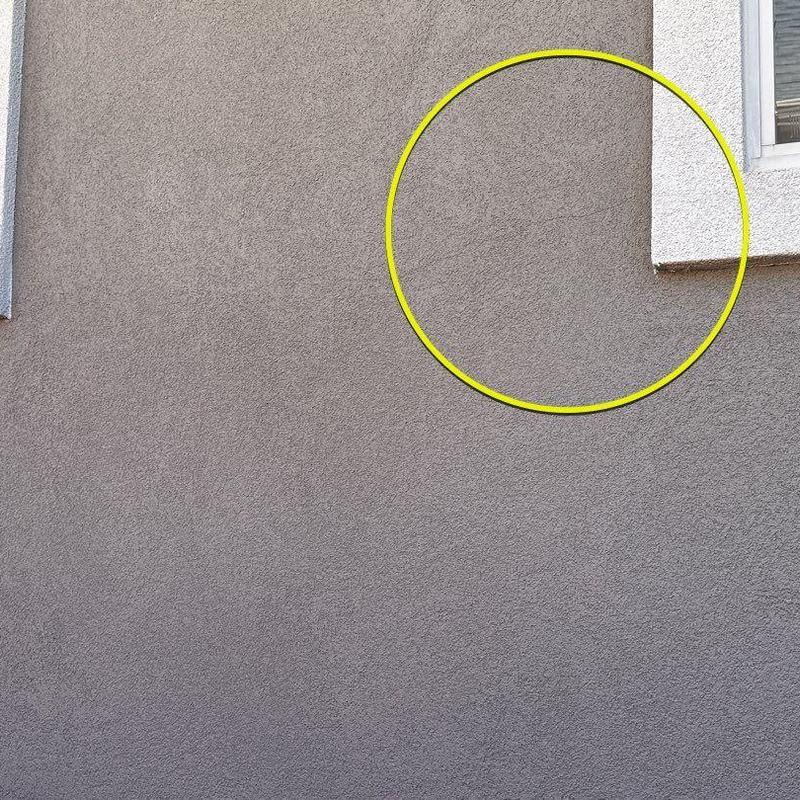 Exterior stucco wall cracks near window trim Exterior stucco wall cracks near window trim
