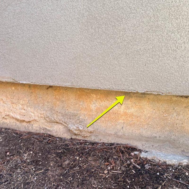 Stucco crack along lower exterior wall edge Stucco crack along lower exterior wall edge