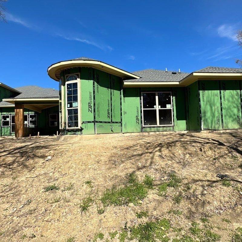 Exterior wall sheathing installation on residential home Exterior wall sheathing installation on residential home