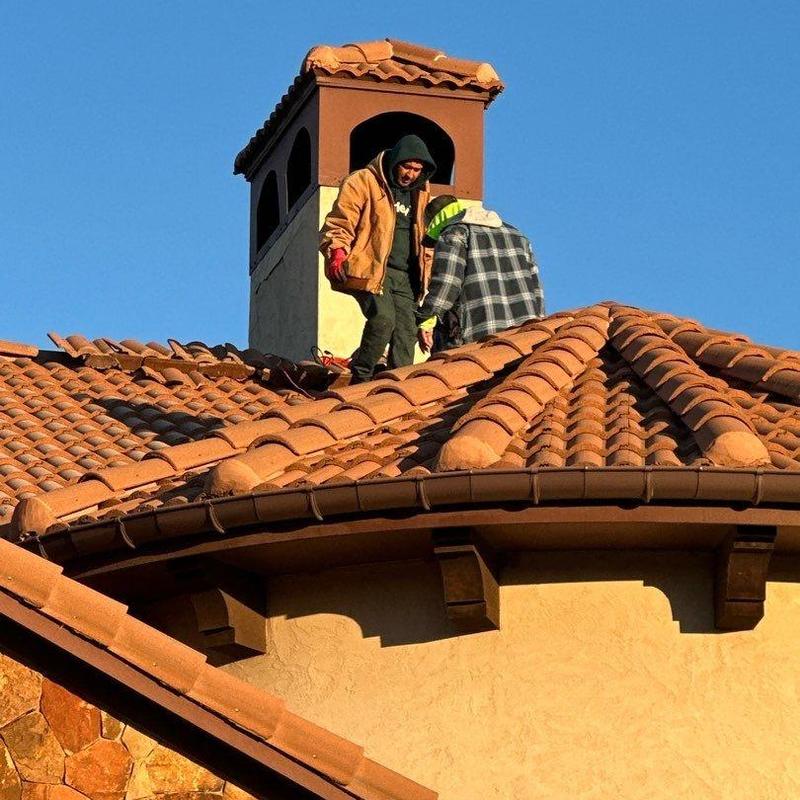 Chimney stucco and tile roof repair on home Chimney stucco and tile roof repair on home