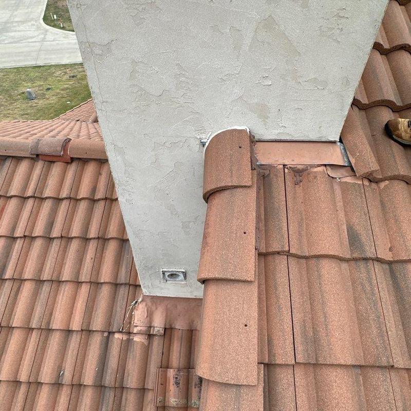 Chimney stucco and roof tile flashing repair detail Chimney stucco and roof tile flashing repair detail