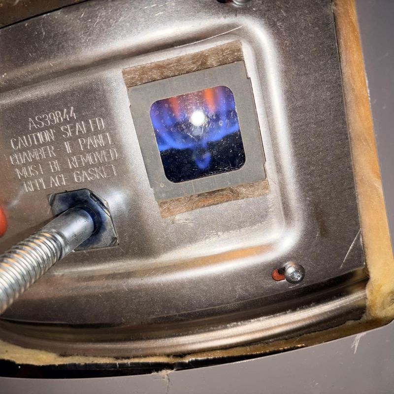 Gas furnace ignition chamber with visible flame Gas furnace ignition chamber with visible flame