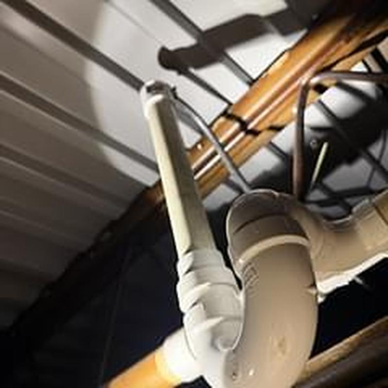 PVC drain pipe with tee and air gap fitting installation