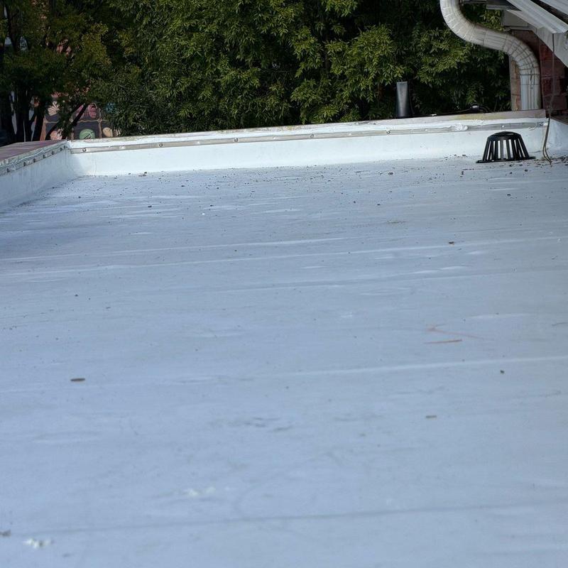 White single-ply membrane roof with roof drain and flashing White single-ply membrane roof with roof drain and flashing