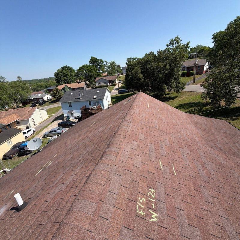Asphalt shingle roof with hail damage inspection markings