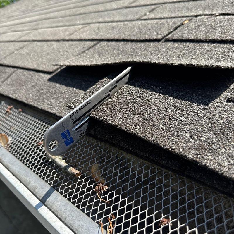 3-tab organic asphalt shingles inspection with gauge tool