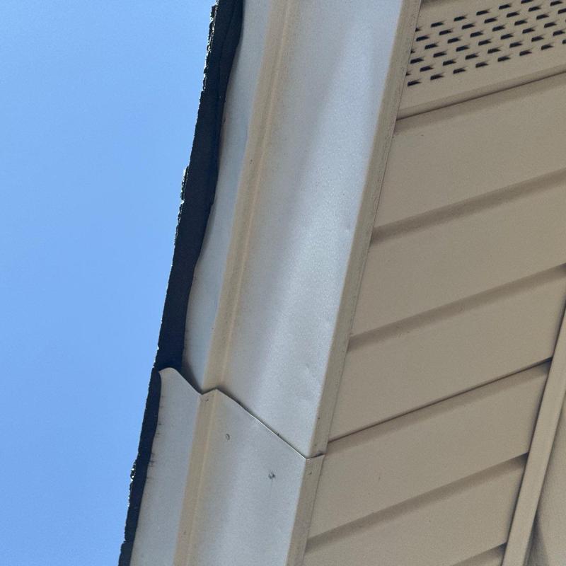 Roof edge flashing with visible wear and gaps