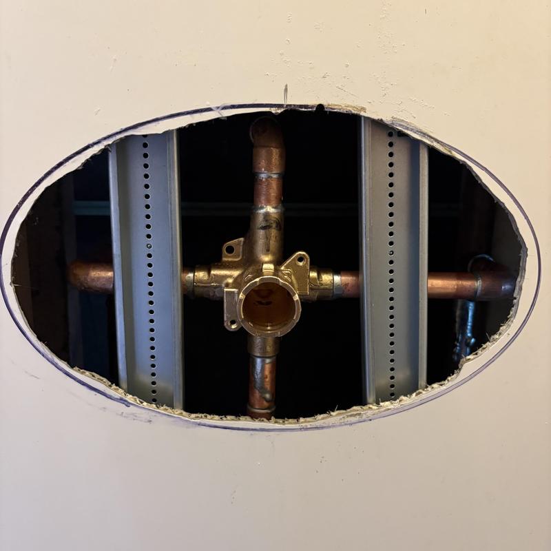Shower valve body installed in wall with copper piping Shower valve body installed in wall with copper piping