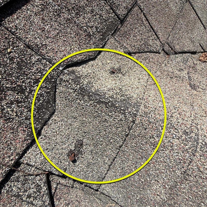 Roof shingles with hail damage on asphalt roof