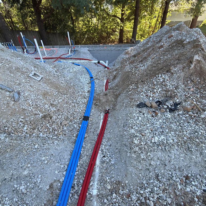 Water and sewer service lines installation at construction site