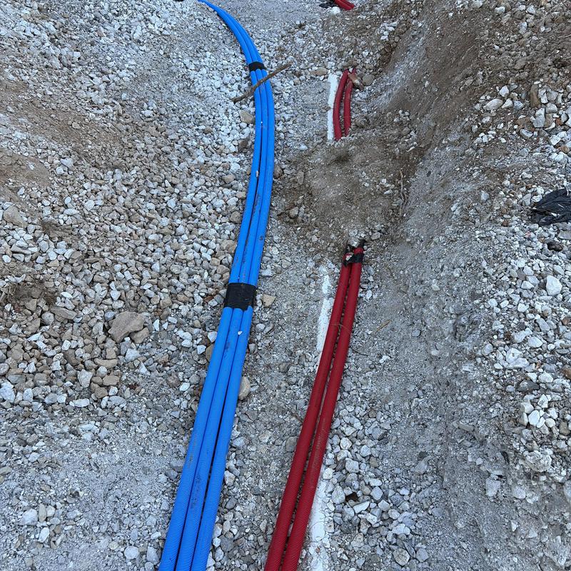 Water and sewer service piping installation in trench