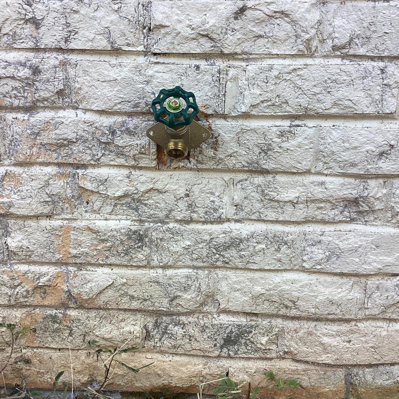 Frost free hose bib mounted on brick wall Frost free hose bib mounted on brick wall