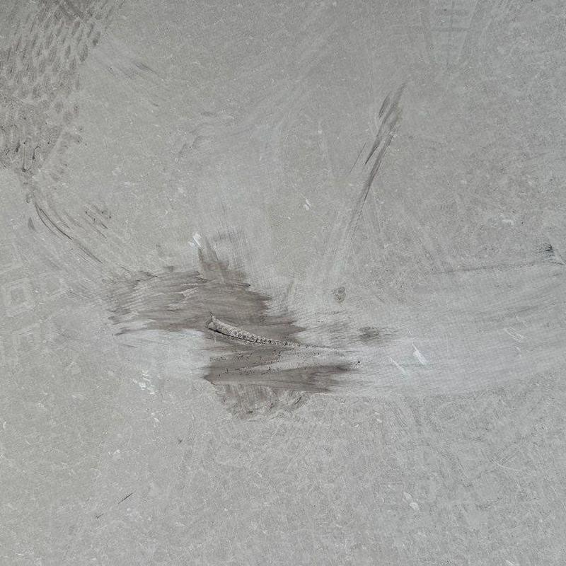 Concrete roof surface with repair patch marks Concrete roof surface with repair patch marks