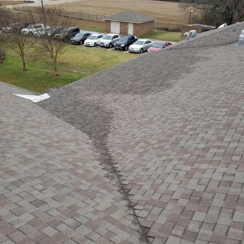 Shingle roof valley with repaired storm damage Shingle roof valley with repaired storm damage
