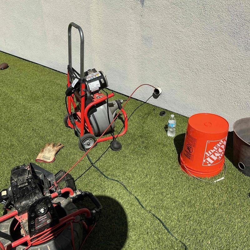 Kitchen drain line snake service through exterior cleanout