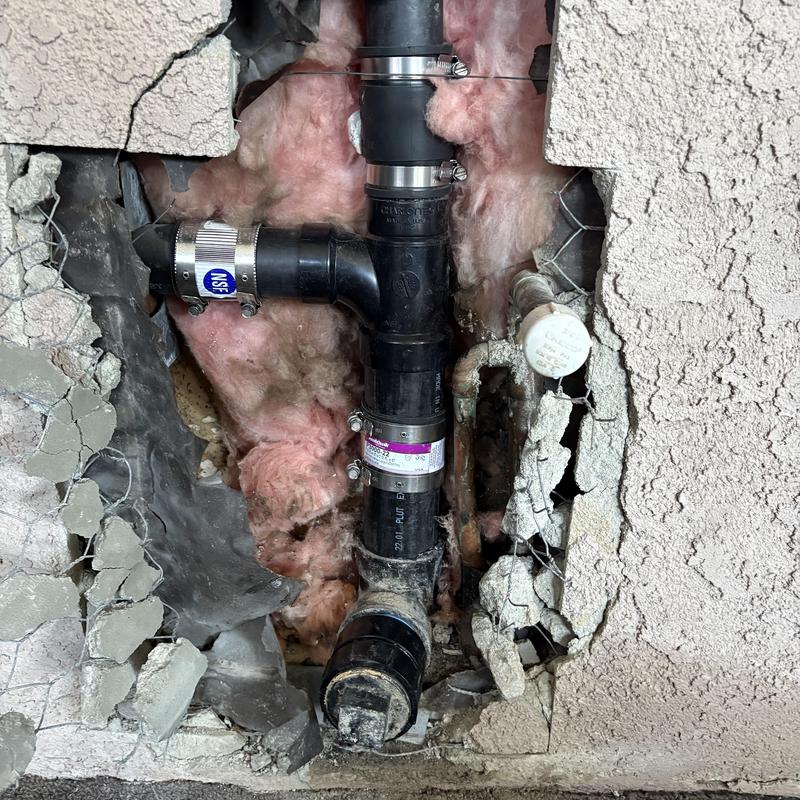 Drain pipe section replacement with clamps and insulation