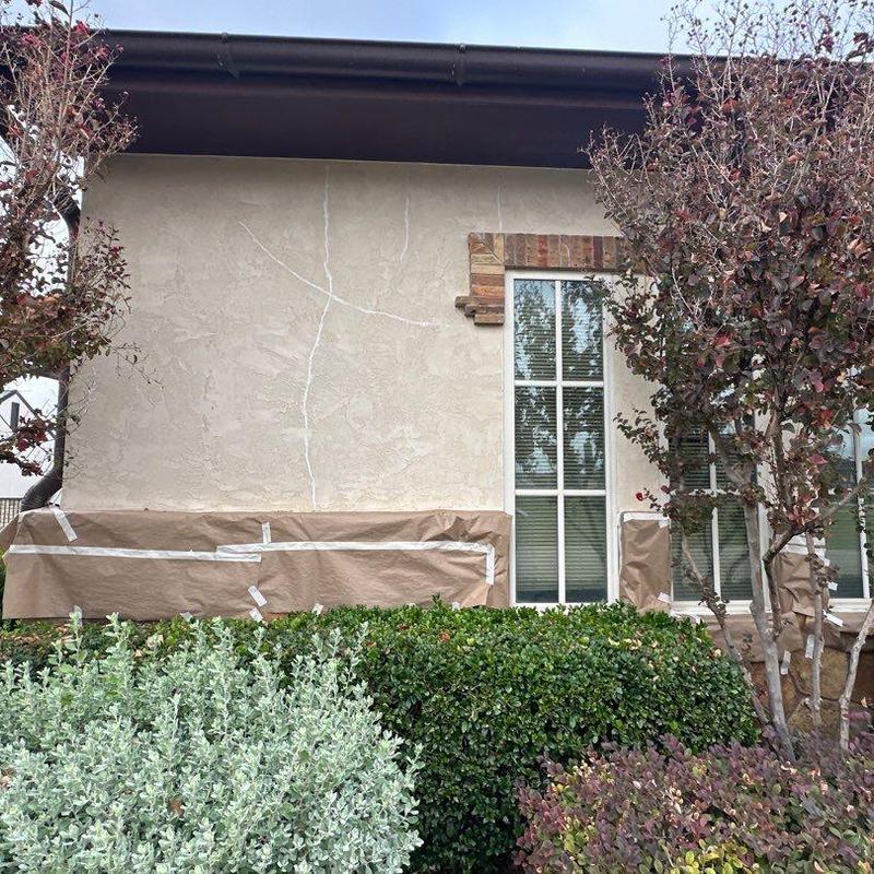 Stucco exterior with windows and landscaping prep Stucco exterior with windows and landscaping prep