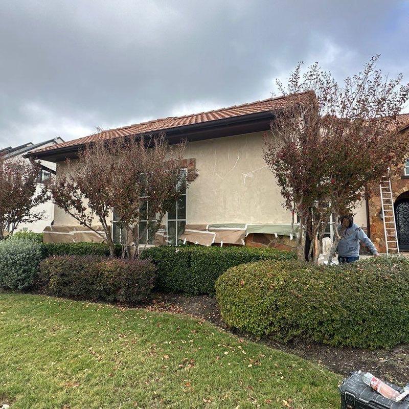 Stucco exterior with window and stone accents painting Stucco exterior with window and stone accents painting