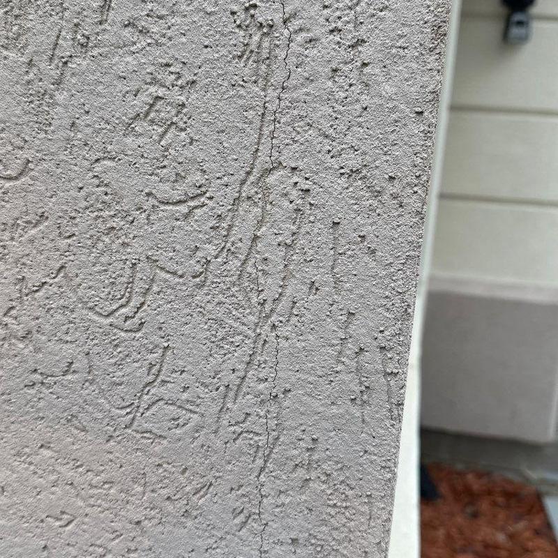 Stucco exterior corner with age-related crack Stucco exterior corner with age-related crack