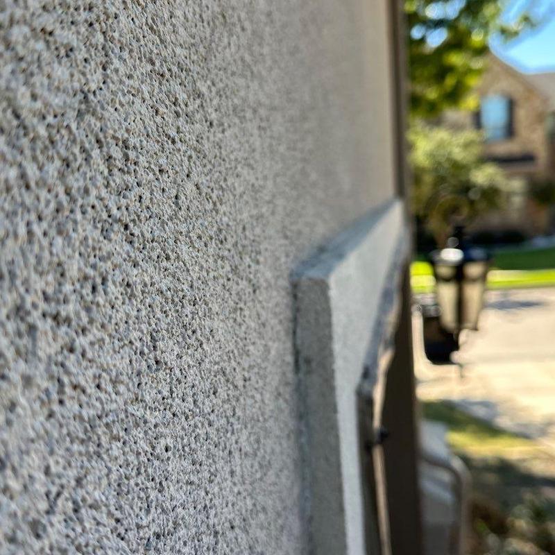 Stucco exterior wall texture close-up with trim Stucco exterior wall texture close-up with trim