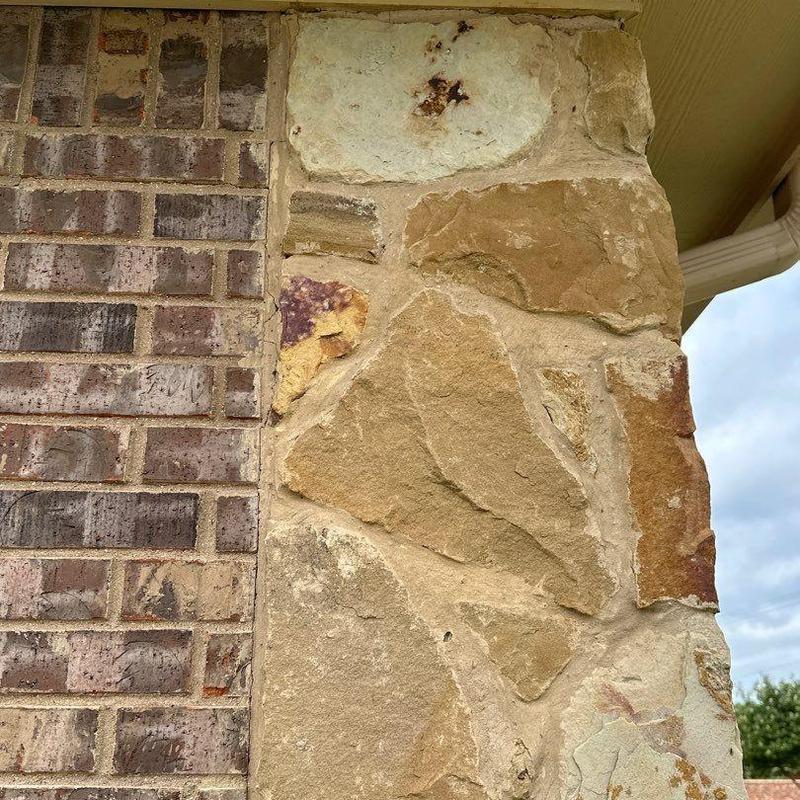 Stone veneer and brick exterior masonry detail Stone veneer and brick exterior masonry detail