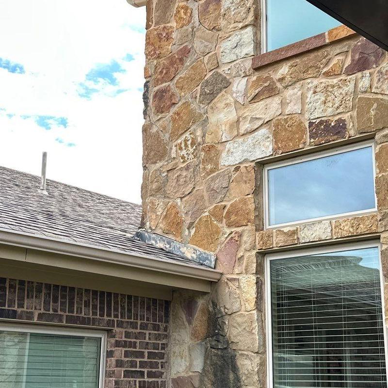 Stone veneer corner and brick joint exterior detail Stone veneer corner and brick joint exterior detail